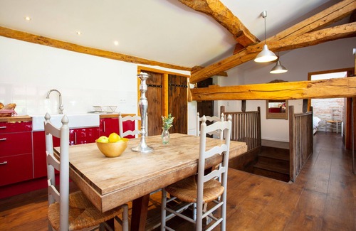 Beauville House | Mutley Barn over looks the unspoilt country-side with floor to ceiling windows.