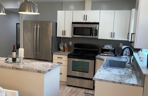 Christina Lake House | New 2 bedroom suite with private parking and entrance steps away from beach