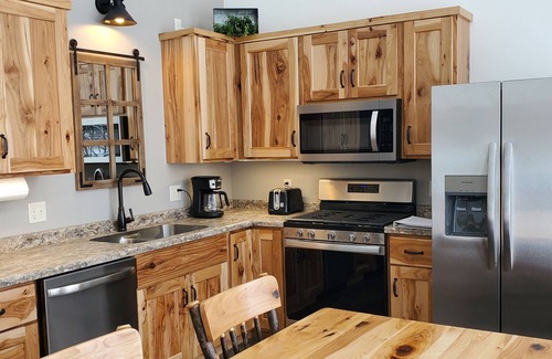 Phillips Cabin | New cabin with lake-facing windows on 400-acre Long Lake of the Phillips Chain.