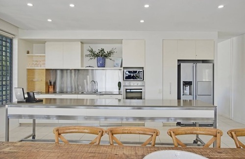 Nelly Bay Apartment | NEW LISTING Luxury Waterfront Four Bedroom Penthouse Blue on Blue Resort