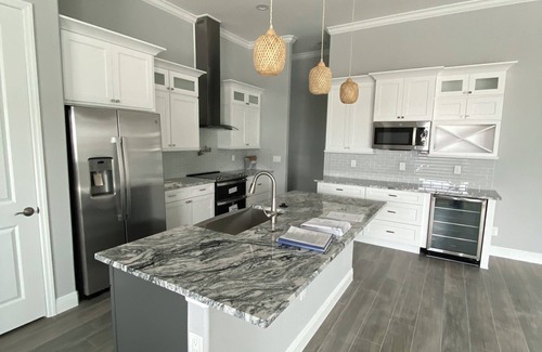 South Gulf Cove House | NEW WATERFRONT POOL HOUSE WITH PRIVATE DOCK – A Gulf Coast Escape from Ordinary