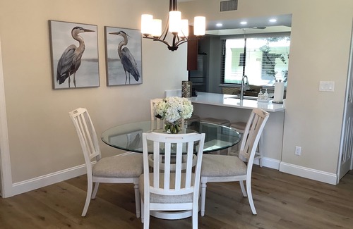 Bonita Bay Condo | Newly Renovated Corner Unit. Lake Views. Shuttle to Beach. Heated Pool/Spa
