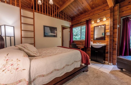 Alert Bay Bed & Breakfast | Ocean View Log Lodge with queen bed. Hot breakfast included.