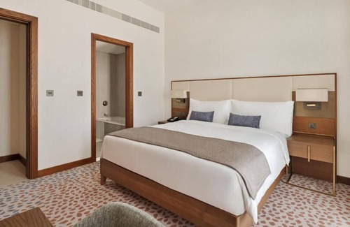 Dubai World Central Hotel | One Bedroom Suite Near Golf View Emaar South By Luxury Bookings AC