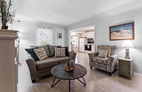 Lakeside House | Peaceful Pastel - Cheerful Cottage Close to Pere Marquette and Muskegon Lake - Pet Friendly