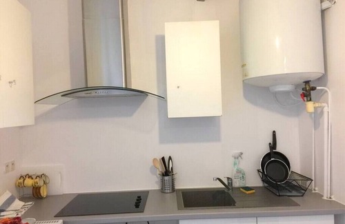 Les Luats Apartment | Pleasant outbuilding in front of a garden in a quiet area