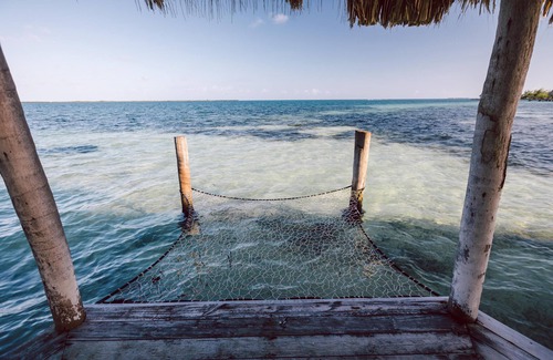 Thatch Caye Resort | Premier Overwater Bungalow w/Air-Conditioning, Patio, & Stunning Ocean Views