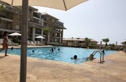 Plage des Nations Apartment | Prestigia plage des nations seen on sea and swimming pool high standing apartment