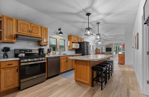 Shawano House | Private Dock! Lakefront! Paddleboards! Firepit