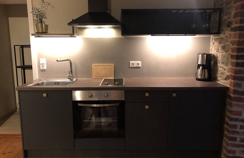 Detmold House | Quaint apartment with fireplace and sauna