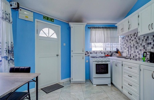 Calliste Apartment | Quaint one bedroom unit steps away from beach access