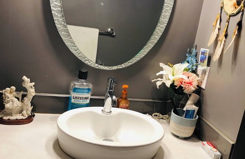 Saint Thomas House | Relax in our cozy room with a private bath, designed for comfort and privacy.