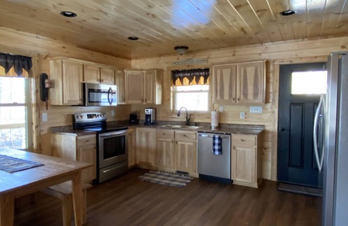 Stanley Cabin | Relax in our secluded hot tub overlooking the pond with a glass of wine