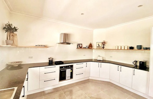 Carbrook House | Relax with your whole family at this serene resort-style retreat.