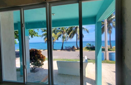 Hatillo House | Relaxed Oceanfront home on quiet palm fringed Beach with large Oceanfront patio