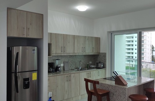 Tonsupa Apartment | Resort Playa Azul Tonsupa Apartment with a view of 2 rooms.