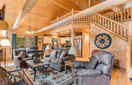 Lyndon Station Cabin | Riverfront cabin with a dock, kayaks and a canoe - firepit and water views