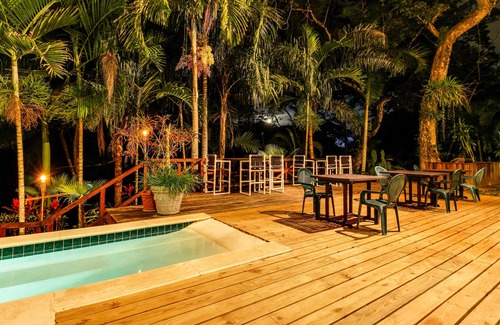 Bullet Tree Falls Apartment | Riverfront Suite with Balcony, WiFi, AC, Infinity Pool & Forest View
