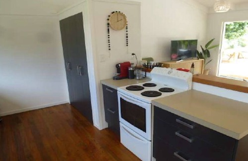Whangamata House | Riverside Retreat - 3 Bedrooms + Fully Contained Sleepout + Hot Tub