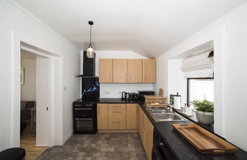 Knockaird Cottage | ROAD END COTTAGE, romantic, with open fire in Port Of Ness