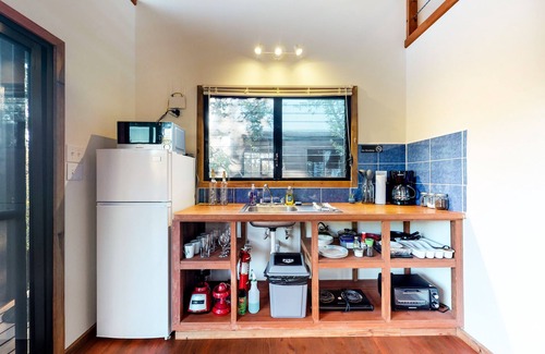 Surfside Cabin | Romantic cabana with veranda, hammock, partial AC & WiFi - walk to the beach