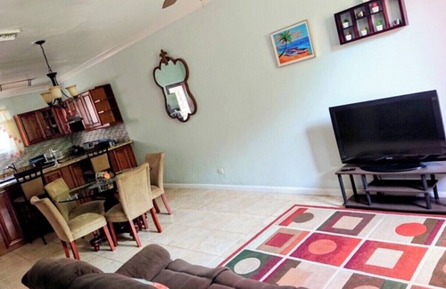 Coral Harbour House | Romantic Getaways or Family fun. Enjoy Island Vibes at 2BR Townhome Near Beach!