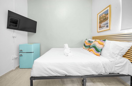 Santurce Hotel | Room 2: Stylish Escape by Calle Cerra Art