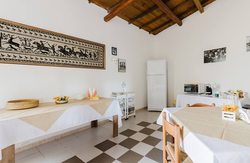 Palmas Arborea Apartment | Room 'Camera 1' with Shared Terrace, Wi-Fi and Air Conditioning