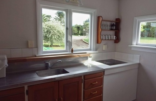 Kaitake Cottage | Rural cottage-large garden and farm outlook.