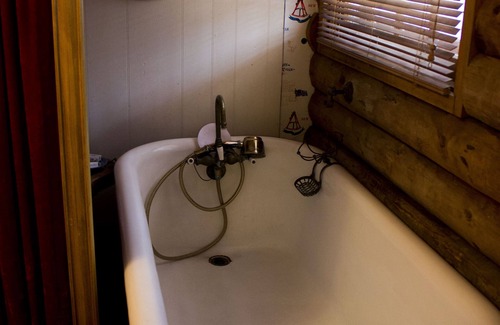 Spencer Bed & Breakfast | Russian and South African room in cabin surrounded by state forest