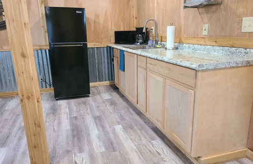 Lee County Apartment | Rustic studio country cabin w/shared pool, firepit, & outdoor kitchen