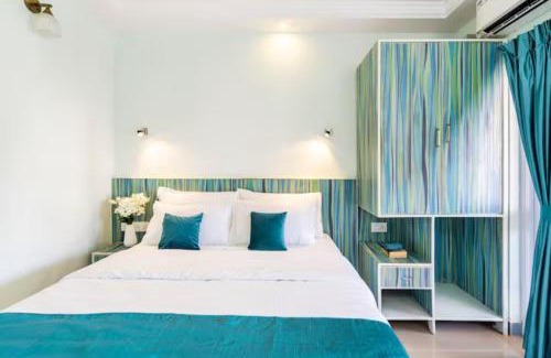 Colva Apartment | Serene Escape One Bedroom Apartment with AC, Wi-Fi, Gym and 5-Minute Walk to the Beach Cativating Tree and Garden Views