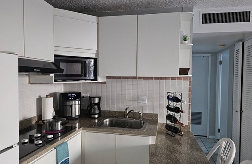 Isla Verde Condo | Short-term stay rental Cozy Isla Verde Beachfront condo with fitness room and AC