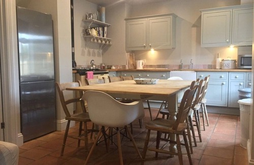 Holt House | Short walk to Holt - lovely cottage with annexe, parking & private lawned garden