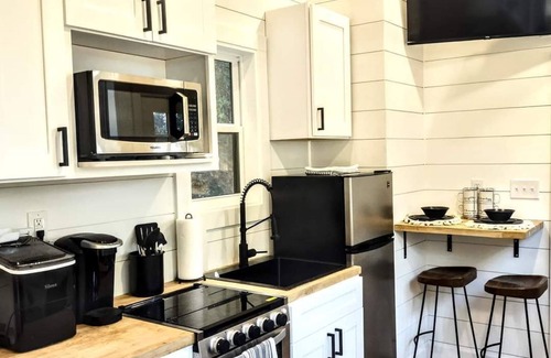 Ashley Oaks House | Simple meets modern in this farmhouse style tiny home!