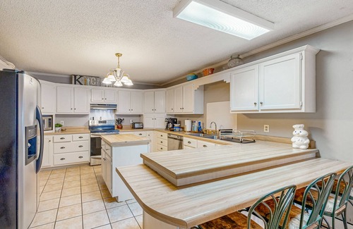 Saltillo House | Single-story home with private deck, grill, fireplace, & W/D