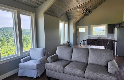 Brooks House | Small cottage house, centered on 100 acres surround by hills, lake, and cattle.