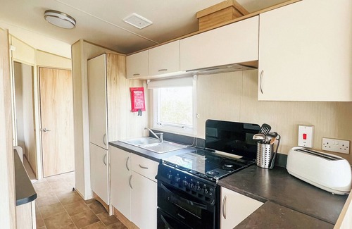 Saint Ann's Chapel House | Spacious 12ft-wide family caravan with one double and one twin.