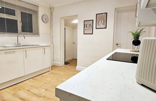 Bedford House | Spacious 5BR House Near Town | Kitchen, Dining & Lounge