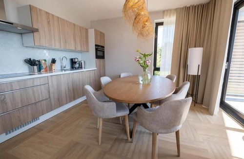 Workum Apartment | Spacious 6-person apartment with sauna, bathtub, and IJsselmeer view. Perfect for families or friends by the water.