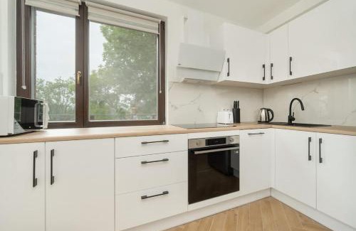 Krzyki Apartment | Spacious Apartment for 11 with 5 Bedrooms in Wrocław by Noclegi Renters