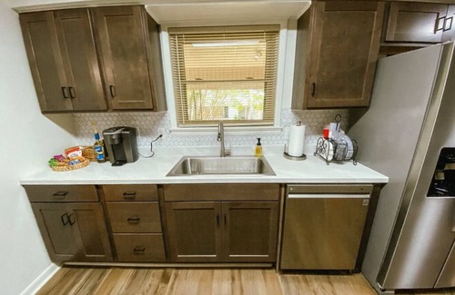 Parsons House | Spacious home in downtown Parsons! Conference room, HS internet, & private yard
