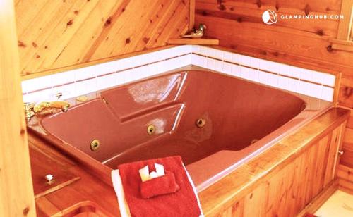West Branch House | Spacious Lake Cabin Rental with a Private Hot Tub in Ogemaw County, Michigan