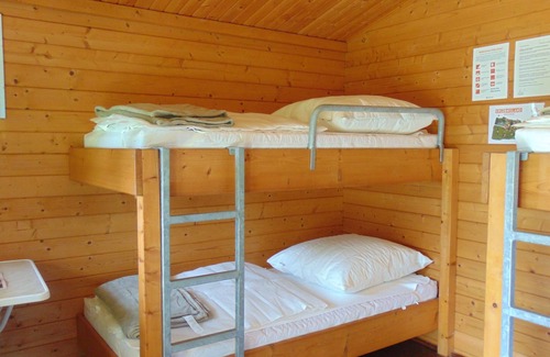 Gelenau Cabin | Squirrel" log cabin at the Gelenau outdoor pool