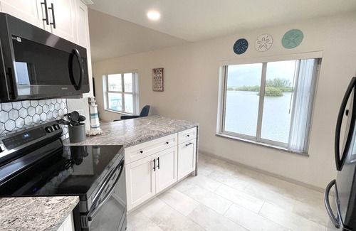 Cocoa Isles Country Club Condo | Stay Where Dolphins Play,Water Front