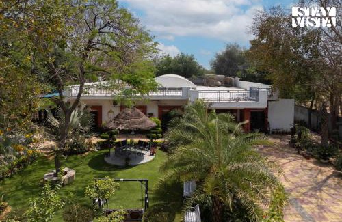 Sohna Villa | StayVista at Leela Retreat with BBQ, Bonfire, Pool & Lawn