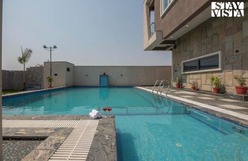 Sitapura Villa | StayVista at Pinkal Farms with Pool, Lawn, Wi-Fi
