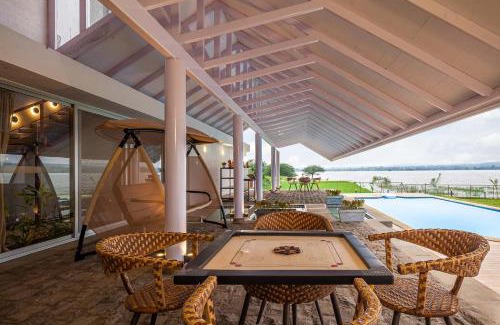 Nashik Villa | StayVista's Eva Villa - Lakeside Luxury with Modern Decor, Pool & Expansive Lawn - Near Sula