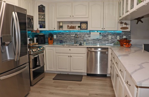 New Smyrna Beach Condo | Steps to south pool deck, pool and ocean from this ground floor, three bedroom, three bath sleeps 8.