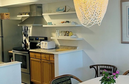 Butler Beach Apartment | Steps to white sand and private beach lie tranquil pastel , 2 story wood condos.